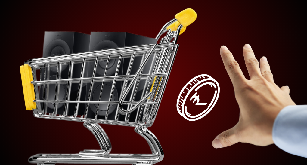 A shopping cart with a pair of speakers and a hand trying to catch it